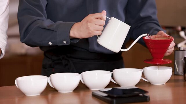 Pouring hot water over coffee grounds in a dripper