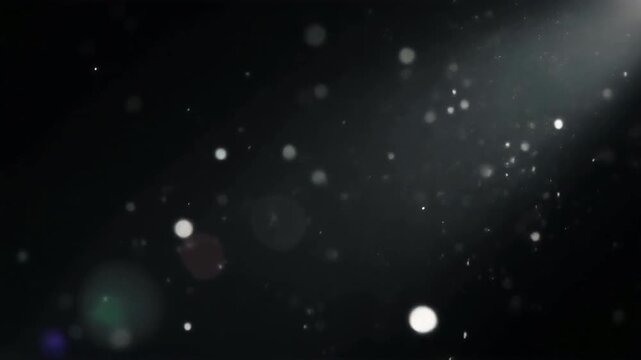 Cinematic firefly dust motes dancing in a dramatic shaft of light against a dark black background with floating particulate matter in 4K