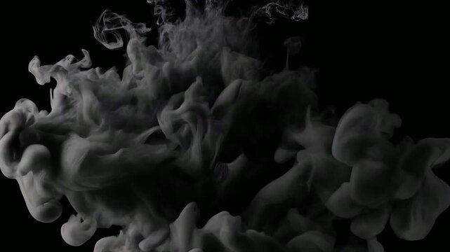 Cinematic deep black ink dispersing in water creating billowing clouds and fluid textures on a dark background for motion graphics.