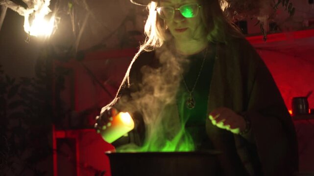 realistic witch brewing a potion. She holds a lit candle over the cauldron, drips wax into it, and chants a spell. Everyday life intertwined with traditional witchcraft. Magic and mystical atmosphere.