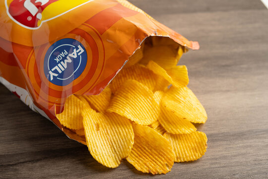 Potato chips delicious BBQ seasoning spicy for crips, thin slice deep fried snack fast food.