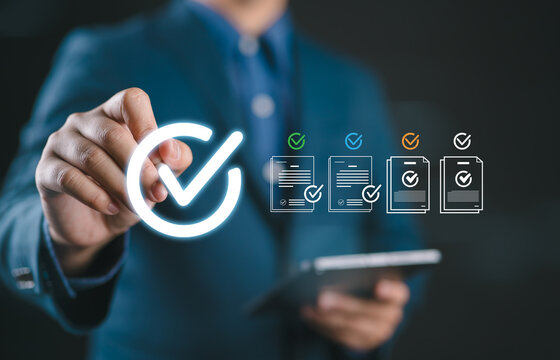 Business professional approving digital documents with green checkmarks, representing compliance verification, workflow approval, quality control, document management, trust, and process efficiency.