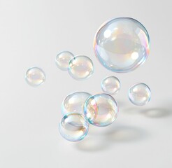 Obraz premium Colorful iridescent soap bubbles floating against white background