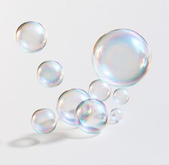 Obraz premium Colorful soap bubbles floating on white background