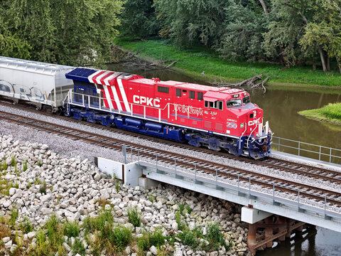 Savanna, Illinois September 8, 2026 CPKC 250 America250 Locomotive &mdash; Semiquincentennial Commemorative Freight Engine crossing a cement bridge