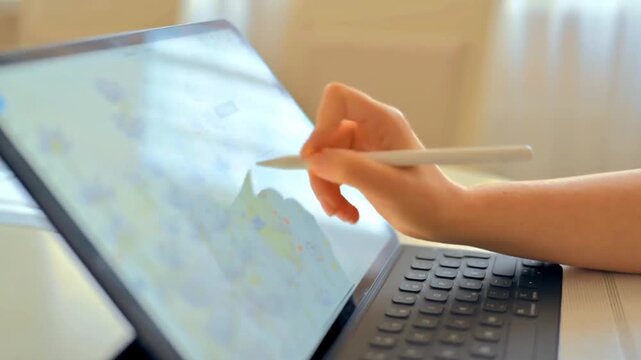Female Artist Creating Digital Artwork With Drawing Tablet