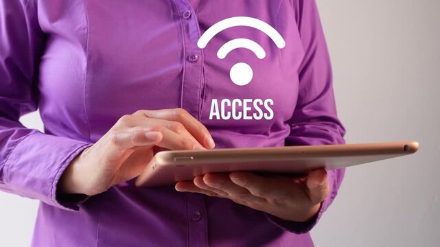 Close-up of a businesswoman interacting with her tablet, featuring a Wi-Fi signal animation and the word "Access."