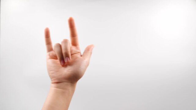 In American Sign Language (ASL), the main sign for love by the ILY gesture, which combines the fingerspelled letters I, L, and Y. Extend your thumb, index finger, and pinky finger outward.