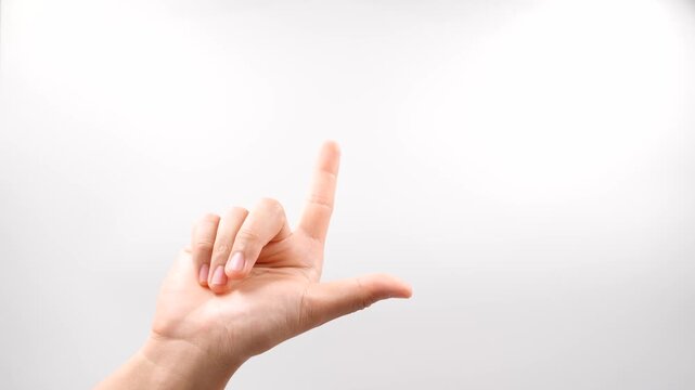 To sign "later" in American Sign Language (ASL), make an "L" shape with your dominant hand and tap or pivot it forward on the palm of your flat, non-dominant hand