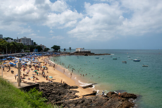 Porto da Barra Beach in Salvador, featuring calm seas, clear waters, and a historic setting that highlights coastal beauty, the tropical climate, and Bahian charm.
