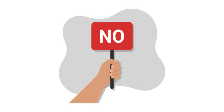 Hand holding red no sign placard against gray abstract background.