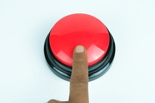 Index finger pressing round big red button on white background, symbolizing emergency, control, and activation, perfect for concepts of safety, alert, and industrial equipment.