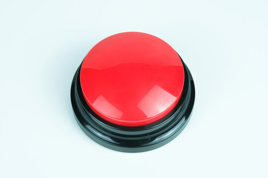 Round big red button on white background, symbolizing emergency, control, and activation, perfect for concepts of safety, alert, and industrial equipment.