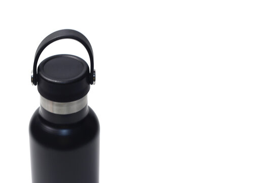 close-up framing the upper half of a matte black thermal bottle, highlighting its silver stainless steel neck and black loop handle.