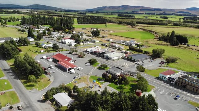Drone panorama of Lumsden and historic railway surrounded by Southland farmland, New Zealand