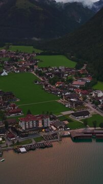 Aerial Sunset View of Achensee Lake Austria with Alpine Village and Mountain Landscape