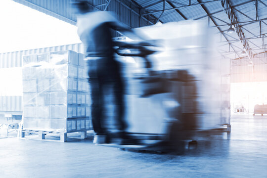 Blur Motion of Workers Loading a Package Boxes in Warehouse. Forklift Loader. Distribution Warehouse Shipping, Supply Chain, Shipment, Warehouse Logistics, Freight Transportation.