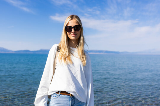 Woman In Sunglasses By The Sayram lake in Xinjiang province China On A Sunny Day