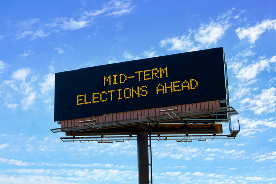 Electronic billboard with 2026 elections ahead message.