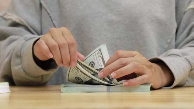 Counting Money Banknotes Hand Stacking Cash. Finance and Business Concept.