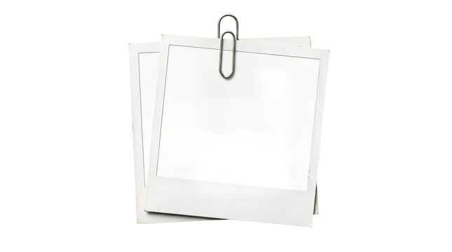 Two blank polaroid instant photo frames held together by metal paperclip for scrapbook and nostalgic photography mockups.