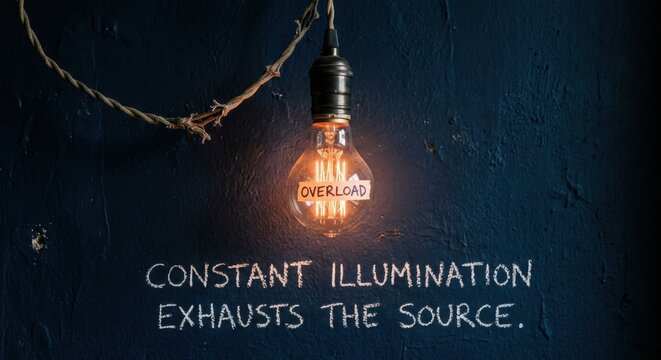 Overloaded lightbulb glows brightly on chalkboard