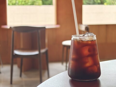 Cold Brew Iced Coffee in Cozy Cafe Interior