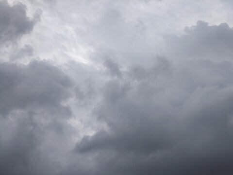 Illuminated Street Lamp Against Overcast Sky