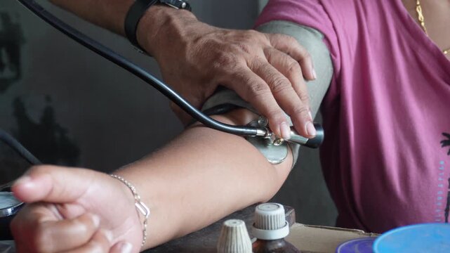 Manual blood pressure measurement with cuff and stethoscope