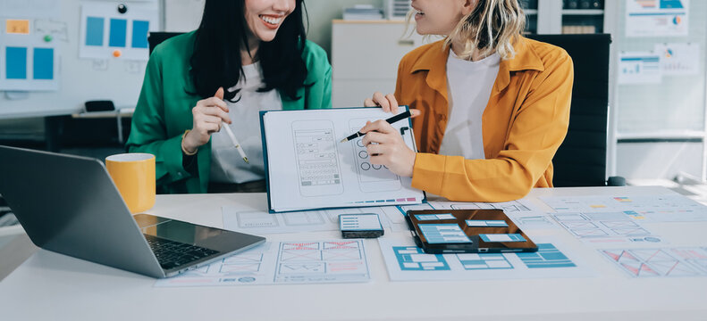 team of UI UX web designer are working together to develop mobile responsive websites with UI UX front end designer previews