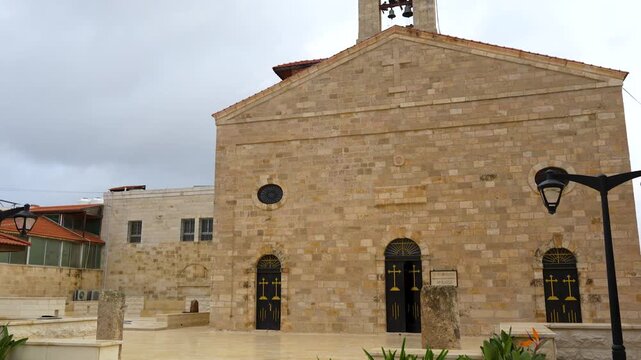 Tilt-Up Exterior View of The Facade of St George's Greek Orthodox Church in Madaba, Jordan. Showcasing Famous Historic Religious Site, Cultural Heritage, Cultural Destination, Jordan Travel Tourism.