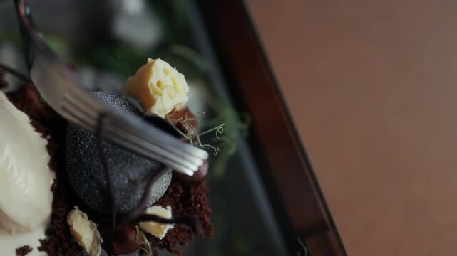 Close-up of a decadent chocolate dessert plated with artistic flair