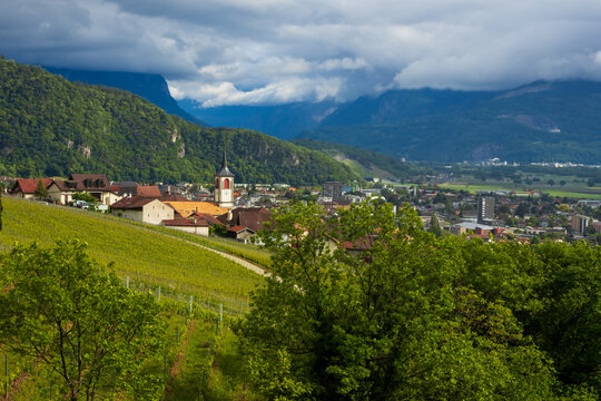 Aigle village church and vineyard in Swiss Alps