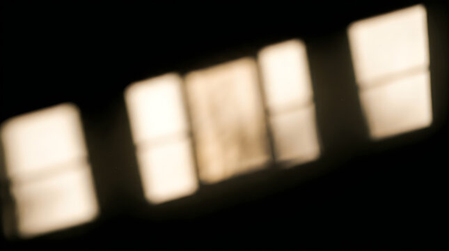 Cinematic window shadow overlay on dark wall background, soft warm sunlight projection through window frame panes, blurred golden hour light effect for realistic interior mockup. Moody