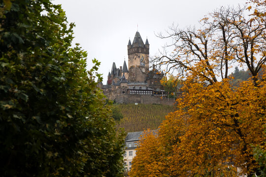 Reichsburg Cochem medieval castle with autumn trees