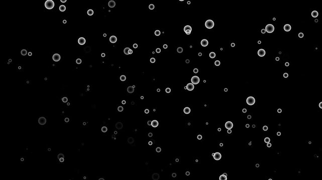 Floating glowing soap bubbles bokeh particles and circular light sphere overlay effect on dark black abstract background.