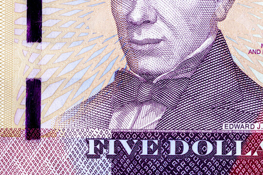 Close-up of a 5 Liberian dollars banknote featuring a portrait of Presiden. Detailed macro shot of Liberia currency paper money bill.