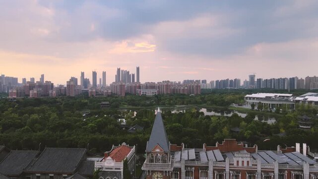 City skyline at sunset with park and clock tower