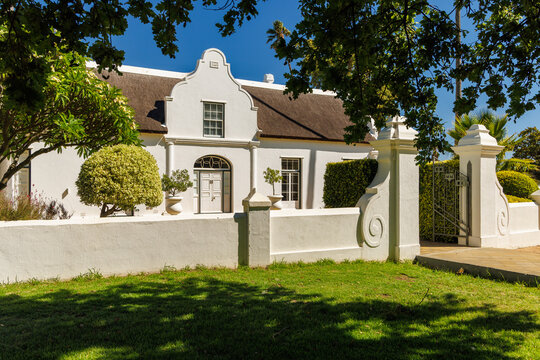 Winery mansion surrounded by greenery in South Africa