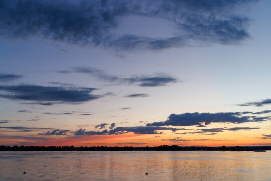 Dramatic twilight sky over river horizon