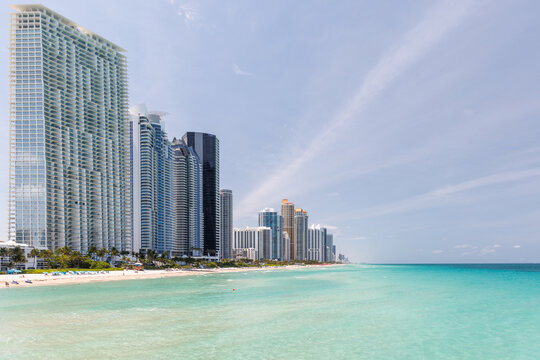 Modern skyline of Miami with towering skyscrapers, tropical vibe, and waterfront views