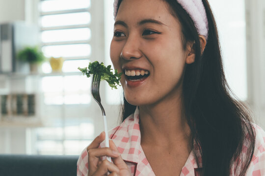 Woman enjoying life at home, promoting healthy eating, wellness, and a balanced lifestyle. Concept of natural nutrition, mindfulness, and modern healthy living.