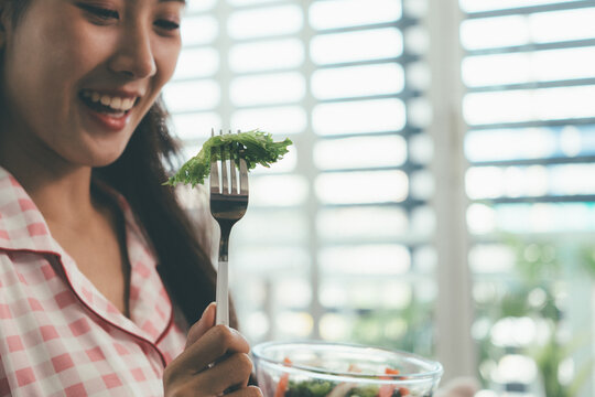 Woman enjoying life at home, promoting healthy eating, wellness, and a balanced lifestyle. Concept of natural nutrition, mindfulness, and modern healthy living.