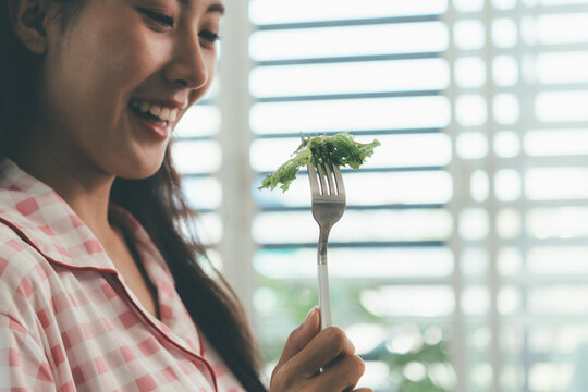 Woman enjoying life at home, promoting healthy eating, wellness, and a balanced lifestyle. Concept of natural nutrition, mindfulness, and modern healthy living.