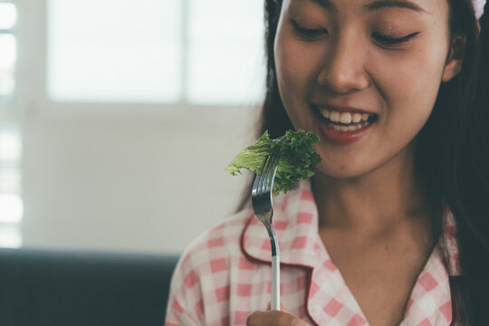 Woman enjoying life at home, promoting healthy eating, wellness, and a balanced lifestyle. Concept of natural nutrition, mindfulness, and modern healthy living.