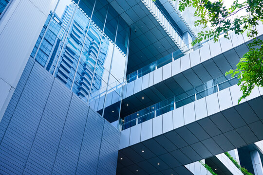 Modern building glass facade reflecting urban city architecture