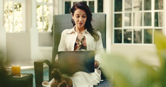 Hotel, typing and woman on laptop for travel blog, online article and lodge review for remote work. Freelancer, hospitality and mature person on computer for research, copywriting and tourism report