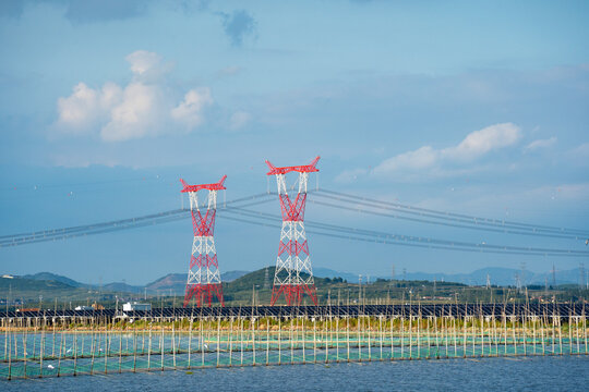 High Voltage Power Towers and Solar Panels Over Water