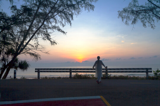 Sunrise and traveler with silhouette