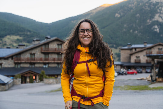Happy woman enjoying mountain hiking vacation in nature